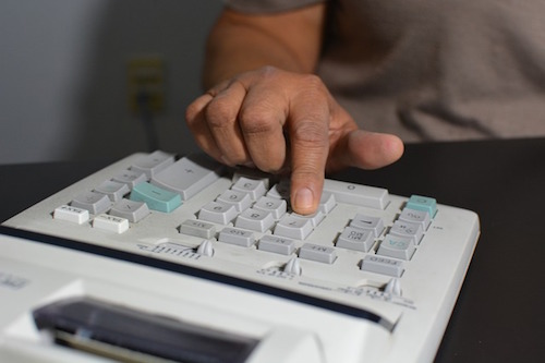 accountant using calculator