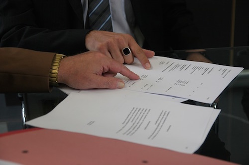 people signing contract